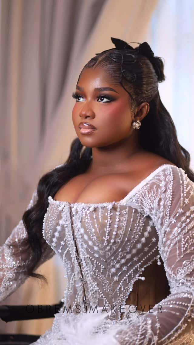 Bride in beaded gown with full glam makeup and styling
